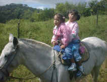 children riding vacation in monteverde