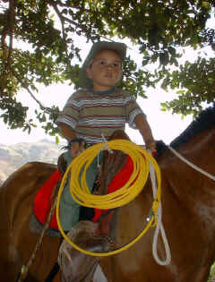 horseback riding yongster at festival  in costa rica